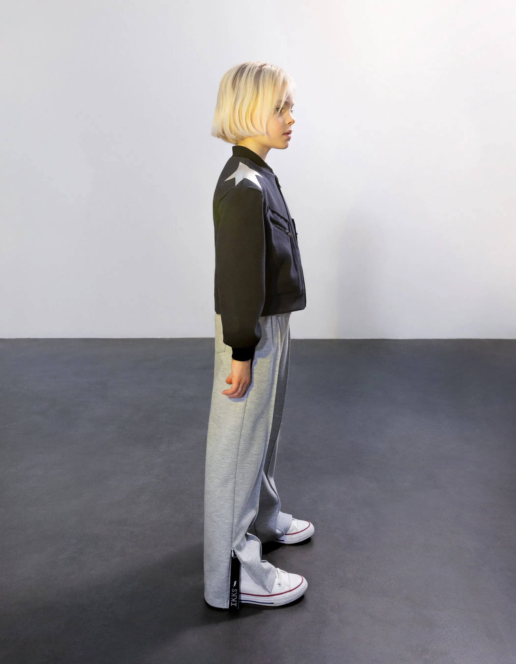 Jogging large gris coutures fixes et bas zippés fille